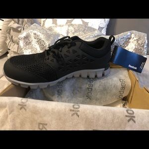 Steel toed Reebok tennis shoes